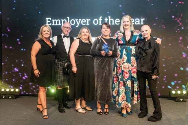 Capella team accepting Employer of the Year Award at the Edinburgh Chamber of Commerce Business Awards
